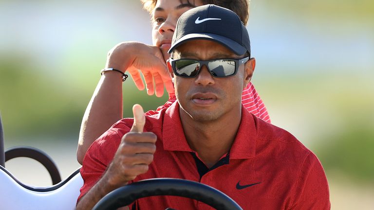 Tiger Woods drives a cart at the Hero World Challenge