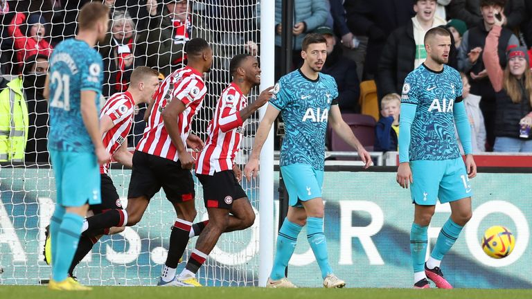 Tottenham players look on after Ivan Toney's goal