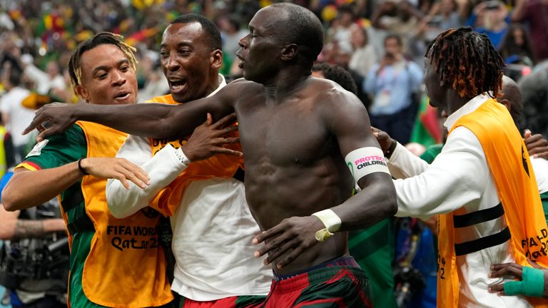 Cameroon's Vincent Aboubakar, center, celebrates with teammates after scoring the opening goal during the World Cup group G soccer match between Cameroon and Brazil, at the Lusail Stadium in Lusail, Qatar, Friday, Dec. 2, 2022. (AP Photo/Andre Penner)