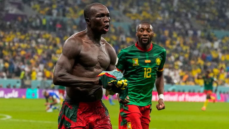 A shirtless Vincent Aboubakar celebrates his goal before the Cameroon forward is shown a second yellow card followed by a red