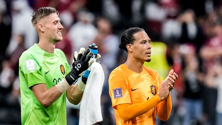 Virgil van Dijk of the Netherlands, right, and his teammate goalkeeper Andries Noppert of the Netherlands applaud at the end of the World Cup group A soccer match between the Netherlands and Qatar, at the Al Bayt Stadium in Al Khor , Qatar, Tuesday, Nov. 29, 2022. (AP Photo/Moises Castillo)