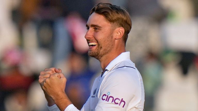 England's Will Jacks, left, celebrates after taking the wicket of Pakistan's Babar Azam, right, during the third day of the first test cricket match between Pakistan and England, in Rawalpindi, Pakistan, Saturday, Dec. 3, 2022. (AP Photo/Anjum Naveed)