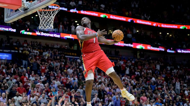 New Orleans Pelicans forward Zion Williamson (1) goes up to dunk against the Phoenix Suns in the second half of an NBA basketball game in New Orleans, Friday, Dec. 9, 2022.