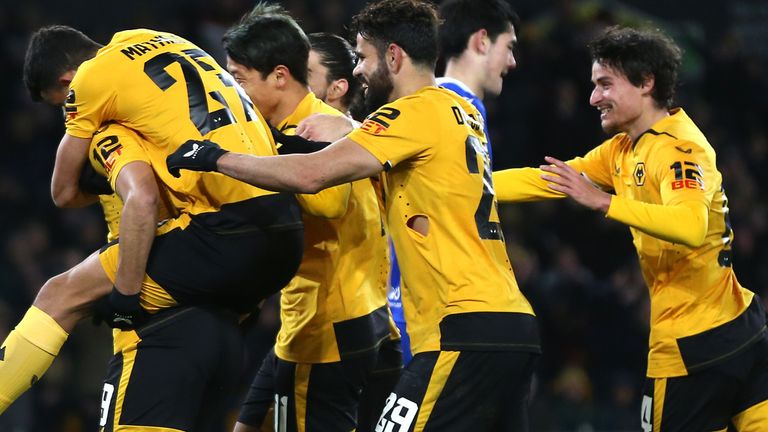 Wolverhampton Wanderers' Raul Jimenez (left) celebrates scoring their side's first goal of the game from the penalty spot with team-mates during the Carabao Cup fourth round match at Molineux Stadium, Wolverhampton. Picture date: Tuesday December 20, 2022.