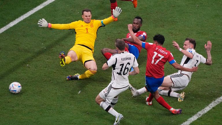 Costa Rica&#39;s Yeltsin Tejeda, second from right, scores his side&#39;s first goal past Germany&#39;s goalkeeper Manuel Neuer during the World Cup group E soccer match between Costa Rica and Germany at the Al Bayt Stadium in Al Khor, Qatar, Thursday, Dec. 1, 2022. (AP Photo/Ariel Schalit)