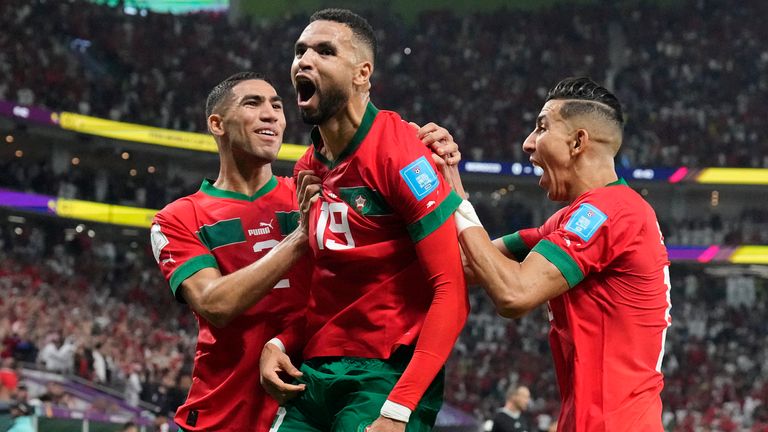 Youssef En-Nesyri celebrates with team-mates after scoring for Morocco