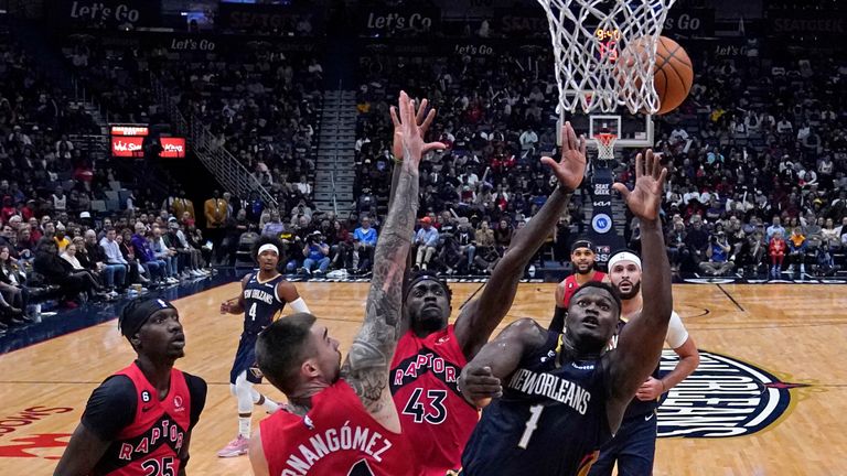 New Orleans Pelicans forward Zion Williamson (1) shoots between Toronto Raptors forward Juancho Hernangomez (41), forward Pascal Siakam (43) and forward Chris Boucher (25) in the second half of an NBA basketball game in New Orleans, Wednesday, Nov. 30, 2022. The Pelicans won 126-108. 