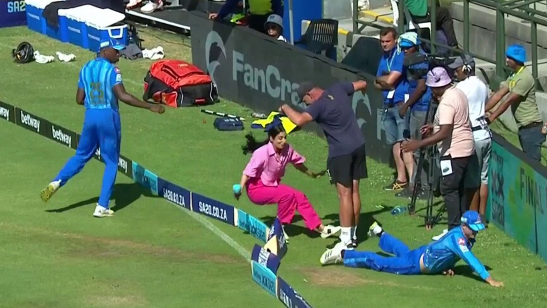 Reporter wiped out by fielder!