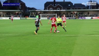 Referee gets nutmegged by Exeter City player!