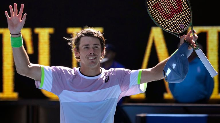 Alex de Minaur of Australia celebrates after defeating Benjamin Bonzi of France in their third round match at the Australian Open tennis championship in Melbourne, Australia, Saturday, Jan. 21, 2023. (AP Photo/Aaron Favila)