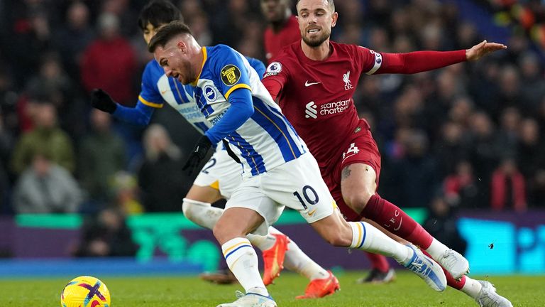 Alexis Mac Allister gets away from Liverpool's Jordan Henderson