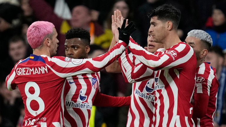 Atletico Madrid&#39;s Alvaro Morata, right, celebrates with teammate Antoine Griezmann after scoring the opening goal during the Spanish Copa del Rey quarter final soccer match between Real Madrid and Atletico Madrid at Santiago Bernabeu stadium in Madrid, Thursday, Jan. 26, 2023. (AP Photo/Bernat Armangue)