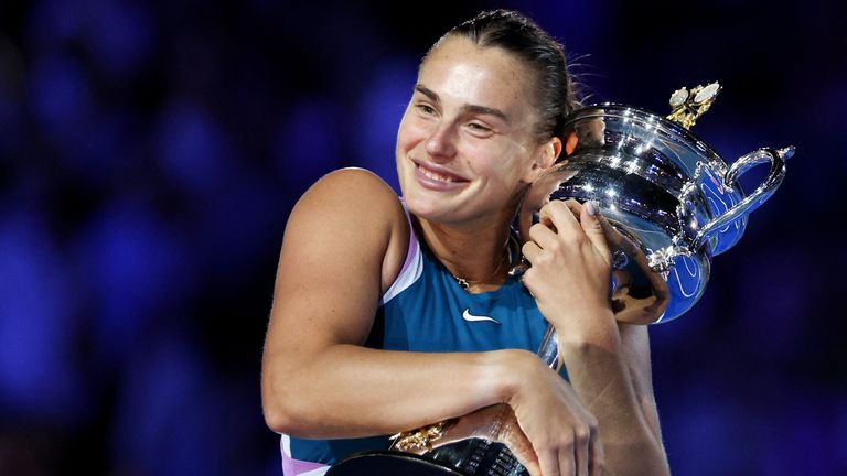 Belarus&#39; Aryna Sabalenka poses with the trophy after winning against Kazakhstan&#39;s Elena Rybakina during the women&#39;s singles final on day thirteen of the Australian Open tennis tournament in Melbourne on January 28, 2023. - -- IMAGE RESTRICTED TO EDITORIAL USE - STRICTLY NO COMMERCIAL USE -- (Photo by Martin KEEP / AFP) / -- IMAGE RESTRICTED TO EDITORIAL USE - STRICTLY NO COMMERCIAL USE -- (Photo by MARTIN KEEP/AFP via Getty Images)