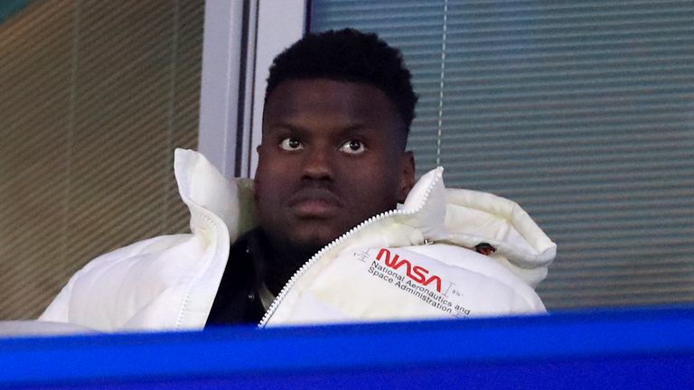 Benoit Badiashile watches on at Stamford Bridge