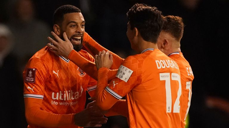 CJ Hamilton celebrates with his team-mates after giving Blackpool a 3-0 lead against Nottingham Forest