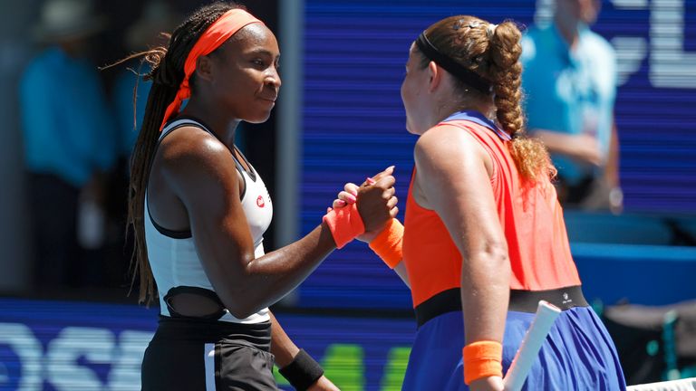 Coco Gauff, left, of the U.S. congratulates Jelena Ostapenko of Latvia following their fourth round match at the Australian Open tennis championship in Melbourne, Australia, Sunday, Jan. 22, 2023. (AP Photo/Asanka Brendon Ratnayake)