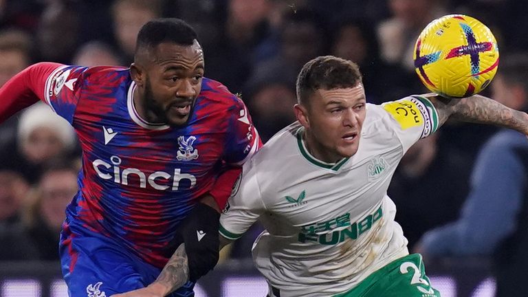 Jordan Ayew and Kieran Trippier chase a loose ball