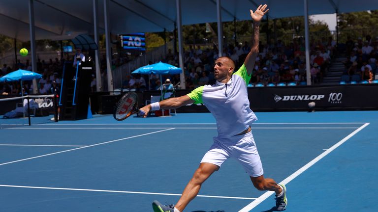 Dan Evans of Britain plays a backhand return to Facundo Bagnis of Argentina during their first round match at the Australian Open tennis championship in Melbourne, Australia, Tuesday, Jan. 17, 2023. (AP Photo/Asanka Brendon Ratnayake)
