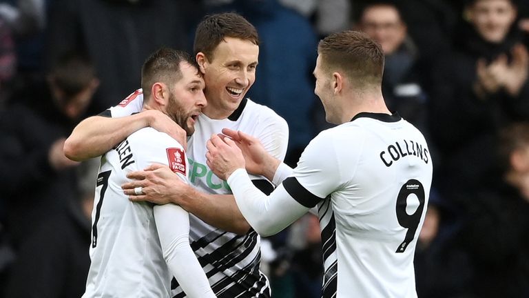 Tom Barkhuizencelebrates with team-mates Craig Forsyth and James Collins after giving Derby a 2-0 lead against Barnsley