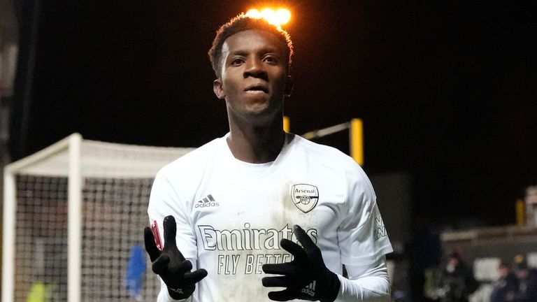 Arsenal's Eddie Nketiah celebrates after he scored his side's second goal past Oxford goalkeeper Edward McGinty during the English FA Cup soccer match between Arsenal and Oxford United at the Kassam Stadium in Oxford, Monday, Jan. 9, 2023.(AP Photo/Frank Augstein)