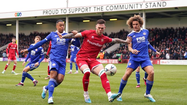 Walsall's Joseph Low (centre) battles for the ball with Leicester City's Wout Faes (right) and Youri Tielemans