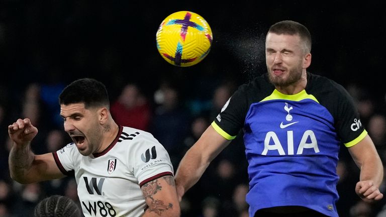 Fulham's Aleksandar Mitrovic jumps for a header with Tottenham's Eric Dier 