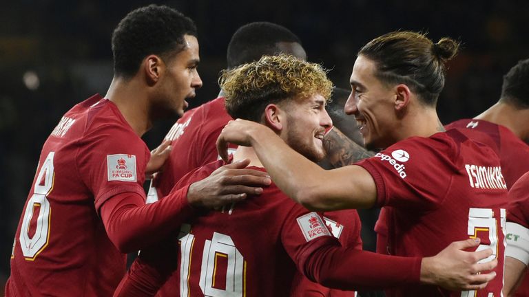 Liverpool&#39;s Harvey Elliott, centre, celebrates with teammates after scoring the opening goal during the English FA Cup 3rd round replay soccer match between Wolverhampton Wanderers and Liverpool at Molineux stadium in Wolverhampton, England, Tuesday Jan. 17, 2023. (AP Photo/Rui Vieira)