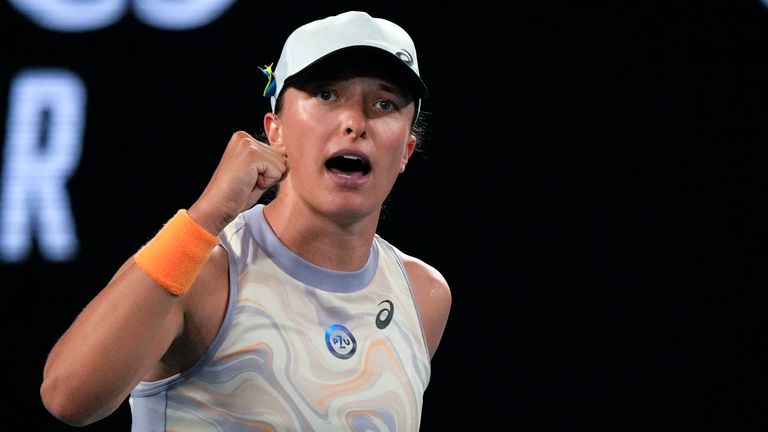 Iga Swiatek of Poland celebrates after defeating Jule Niemeier of Germany in their first round match at the Australian Open tennis championship in Melbourne, Australia, Monday, Jan. 16, 2023. (AP Photo/Aaron Favila)