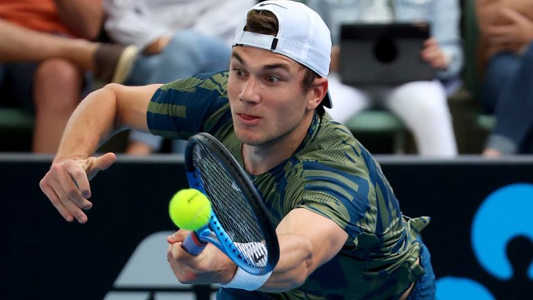 Great Britain's Jack Draper makes a forehand return to Russia's Karen Khachanov during their Round of 16 match at the Adelaide International Tennis tournament in Adelaide, Australia, Wednesday, Jan. 4, 2023. (AP Photo/Kelly Barnes)