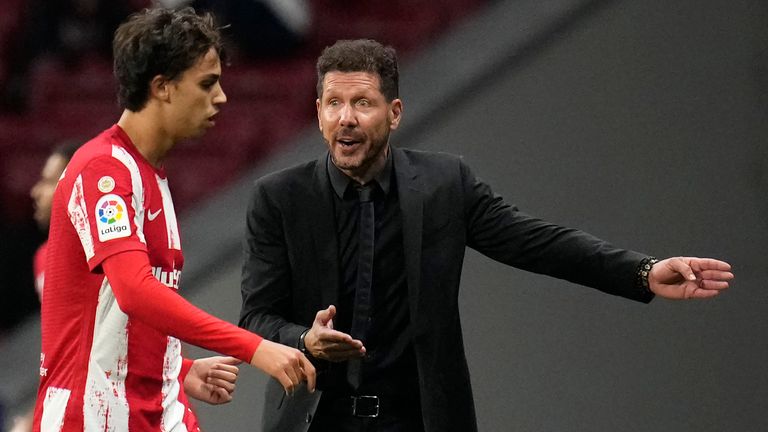 Atletico Madrid's head coach Diego Simeone, right, talks to Joao Felix during the La Liga soccer match between Atletico Madrid and Real Sociedad at the Estadio Wanda Metropolitano in Madrid, on Oct. 24, 2021. (AP Photo/Manu Fernandez, File)