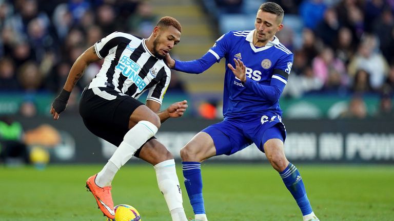 Newcastle' Joelinton and Leicester's Dennis Praet (right) battle for the ball 