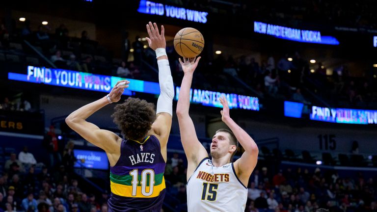 Denver Nuggets center Nikola Jokic shoots over New Orleans Pelicans center Jaxson Hayes in the second half of an NBA basketball game in New Orleans, Tuesday, Jan.  24, 2023.