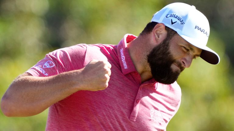 Jon Rahm, of Spain, celebrates his birdie putt on the 18th green during the final round of the Tournament of Champions golf event, Sunday, Jan. 8, 2023, at Kapalua Plantation Course in Kapalua, Hawaii. (AP Photo/Matt York)