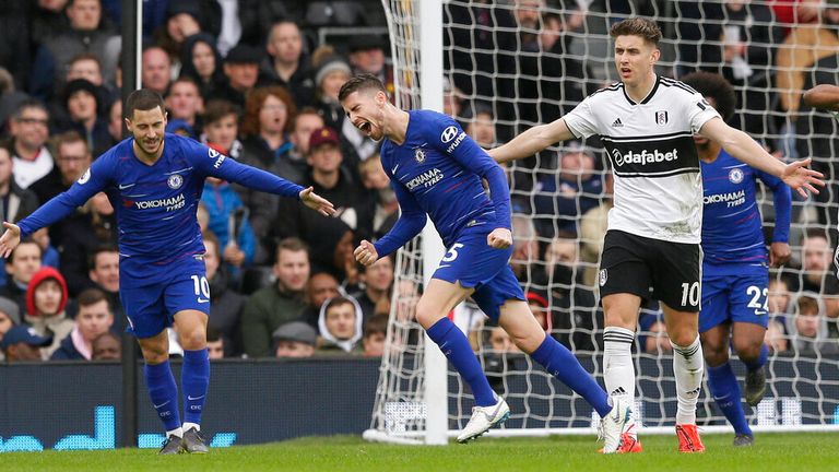 Chelsea's Jorginho, center, celebrates with his teammate Eden Hazard after scoring his side's second goal during the English Premier League soccer match between Fulham and Chelsea at Craven Cottage stadium in London, England, Sunday, March 3, 2019. (AP Photo/Tim Ireland)