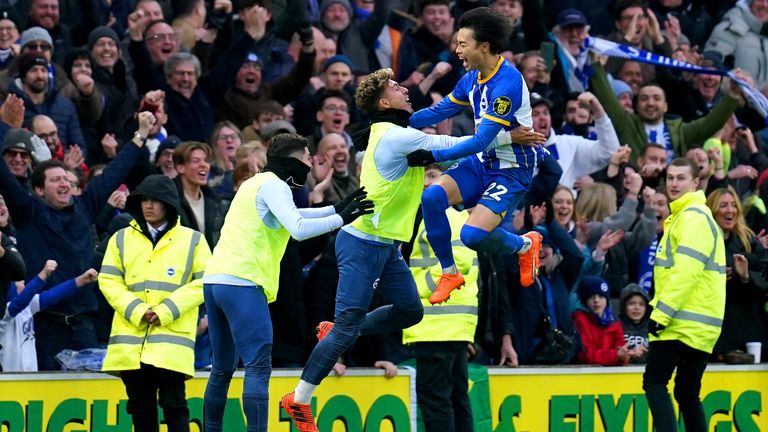 Brighton's Kaoru Mitoma celebrates with his team-mates after sending them through to the fifth round of the FA Cup
