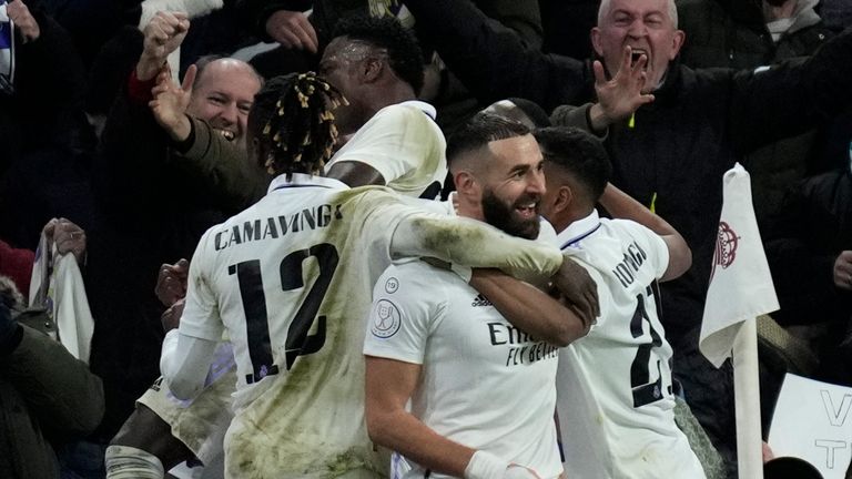 Real Madrid's Karim Benzema, left, celebrates with teammates after scoring his side's second goal during the Spanish Copa del Rey quarter final soccer match between Real Madrid and Atletico Madrid at Santiago Bernabeu stadium in Madrid, Thursday, Jan. 26, 2023. (AP Photo/Bernat Armangue)