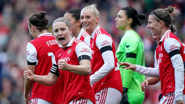 Kim Little (left) celebrates with her Arsenal team-mates