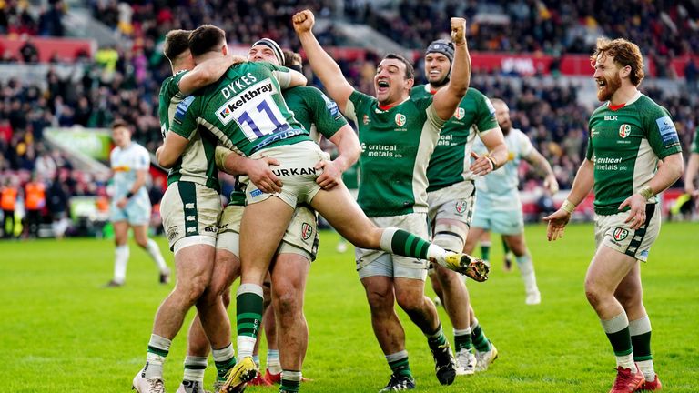 London Irish's Michael Dykes celebrates with his team-mates after scoring a try against Harlequins