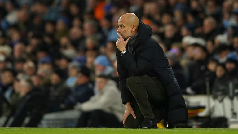 Manchester City's head coach Pep Guardiola watches during the English FA Cup soccer match between Manchester City and Chelsea at the Etihad Stadium in Manchester, England, Sunday, Jan. 8, 2023. (AP Photo/Dave Thompson)