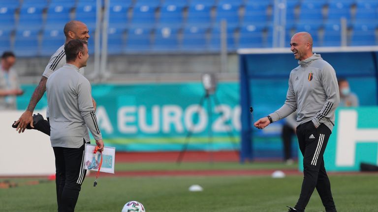 Henry (left) was Roberto Martinez's (right) assistant before his departure