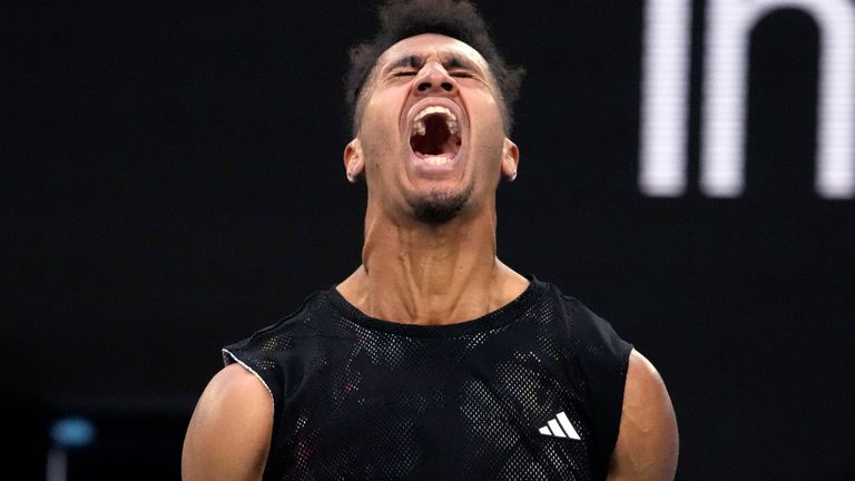 Michael Mmoh of the U.S. reacts after winning a point against Alexander Zverev of Germany during their second round match at the Australian Open tennis championship in Melbourne, Australia, Thursday, Jan. 19, 2023. (AP Photo/Ng Han Guan)