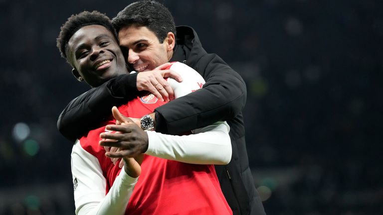 Mikel Arteta embraces Bukayo Saka at full-time after the win over Spurs