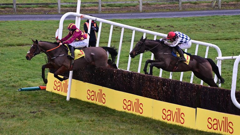 Minella Indo clears a fence ahead of Stattler in the Savills New Year's Day Chase