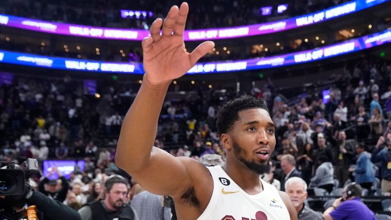 Cleveland Cavaliers guard Donovan Mitchell (45) waves to Utah Jazz fans as he walks off the court following a game against his former team, 