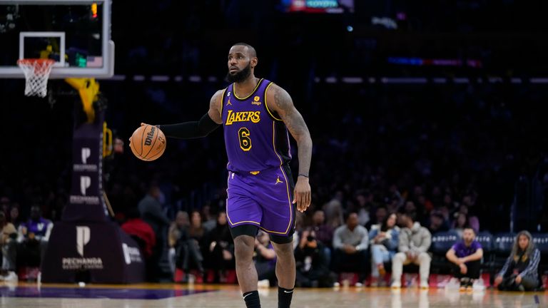 Los Angeles Lakers' LeBron James, 6, dribbles in the first half of an NBA basketball game against the Atlanta Hawks.