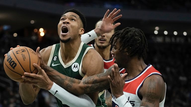 Washington Wizards' Delon Wright fouls Milwaukee Bucks' Giannis Antetokounmpo.