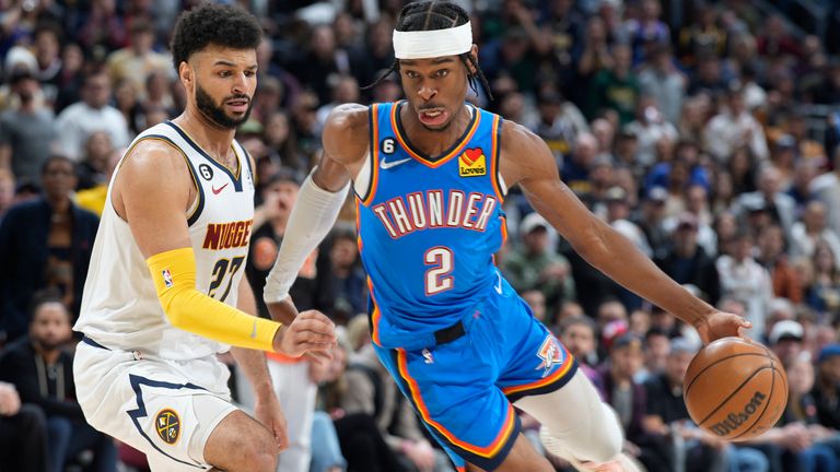 Oklahoma City Thunder guard Shai Gilgeous-Alexander, right, drives past Denver Nuggets guard Jamal Murray in the second half of an NBA basketball game Sunday.