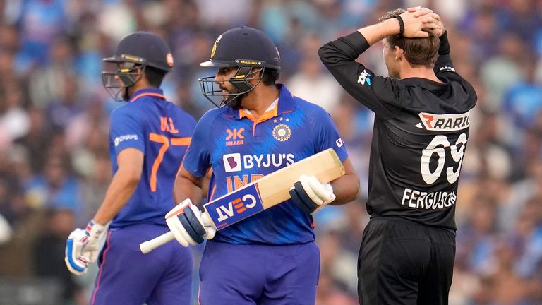 New Zealand's Lockie Ferguson, right, watches the ball as India's captain Rohit Sharma, center, and Shubhman Gill run between the wickets to score during the second one-day international cricket match between India and New Zealand in Raipur, India, Saturday, Jan. 21, 2023. (AP Photo/Aijaz Rahi)