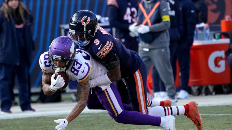 Minnesota Vikings wide receiver Jalen Nailor (83) is tackled by Chicago Bears safety Jaquan Brisker (9) after catching a pass during the second half of an NFL football game, Sunday, Jan. 8, 2023, in Chicago.