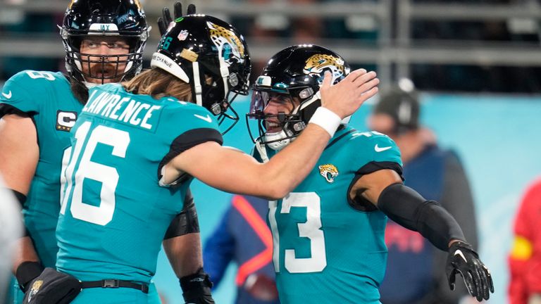 Jacksonville Jaguars wide receiver Christian Kirk celebrates his touchdown reception with quarterback Trevor Lawrence in the first half of an NFL football game against the Tennessee Titans, Saturday, Jan. 7, 2023, in Jacksonville, Fla. 